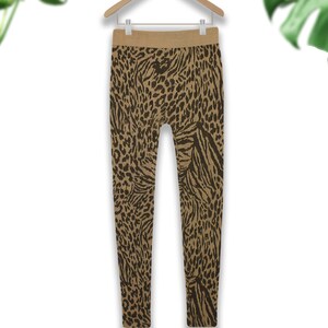 May include: Brown leggings with a black leopard print pattern.
