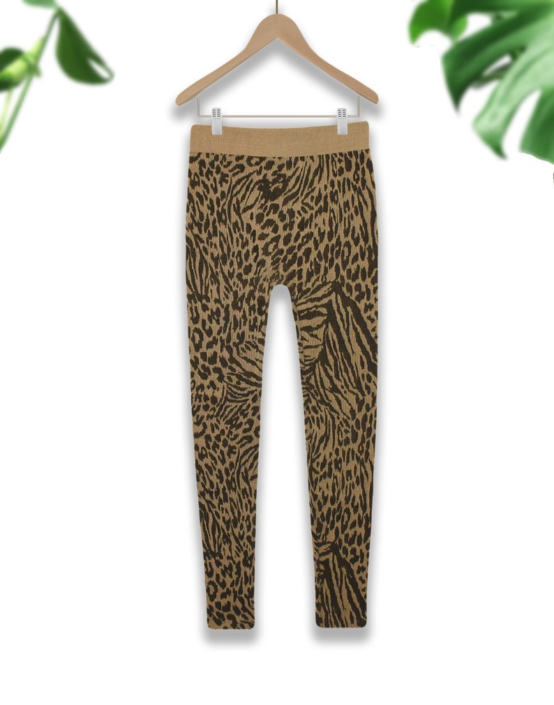 May include: Brown leggings with a black leopard print pattern.