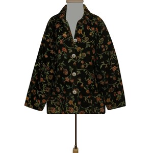 May include: A black floral patterned jacket with a button-up front and long sleeves.