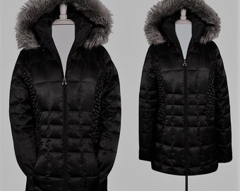 May include: Black quilted winter jacket with a faux fur lined hood. The jacket has a zipper closure and a diamond quilted pattern.