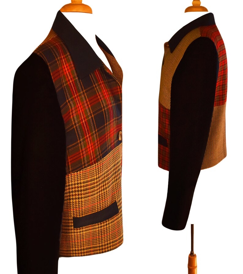 May include: A black, brown, and red plaid jacket with a black collar and a brown and black houndstooth pattern on the bottom. The jacket has a button closure and two pockets.