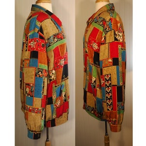 May include: A long-sleeved shirt with a patchwork design featuring various colors and patterns, including red, blue, green, and black. The shirt has a button-up collar and a relaxed fit.