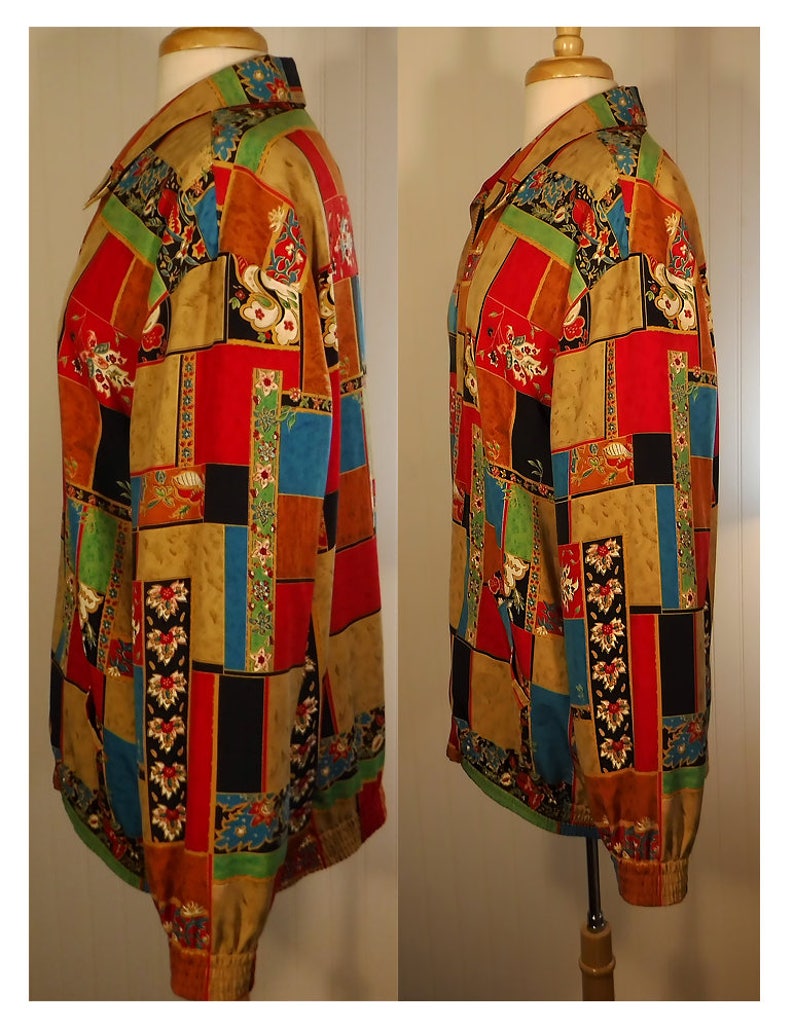 May include: A long-sleeved button-up shirt with a patchwork design featuring various colors and patterns, including red, blue, green, black, and gold.