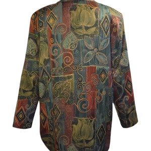 May include: A long-sleeved, patterned blazer in shades of teal, burgundy, and olive green. The fabric features a repeating design of stylized flowers, leaves, and geometric shapes outlined in gold. The blazer has a collared neckline.