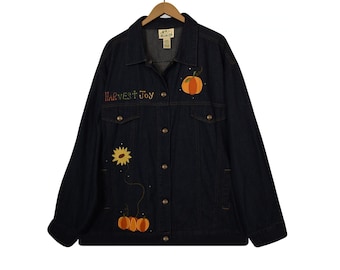 May include: A dark blue denim jacket with embroidered autumn-themed designs, including pumpkins, sunflowers, and the text "HARVEST JOY".