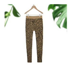 May include: Brown leggings with a black leopard print pattern.