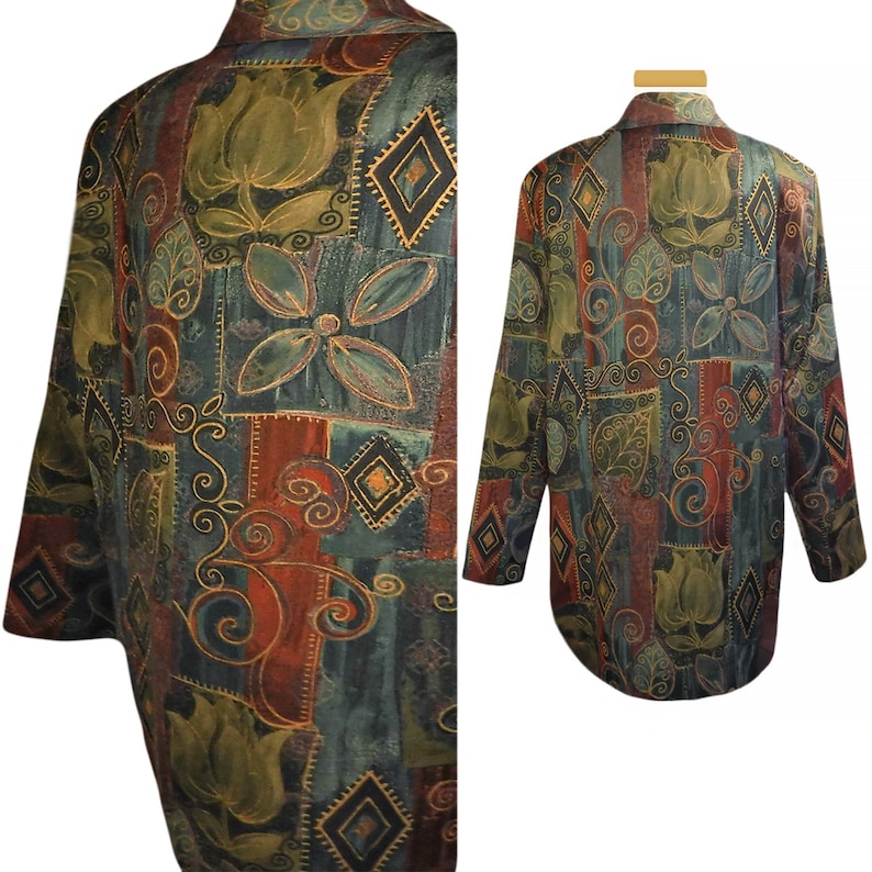 May include: A long-sleeved, collared shirt with a unique, artistic pattern. The design features floral and geometric shapes in shades of green, red, and gold on a dark teal background. The shirt has a relaxed fit and a classic button-down style.