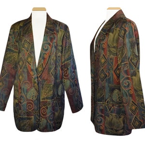 May include: A patterned blazer with a colorful design. The jacket features a mix of colors, including green, red, and blue, with a diamond and floral pattern. The blazer has a classic cut with a notched lapel and two front pockets.
