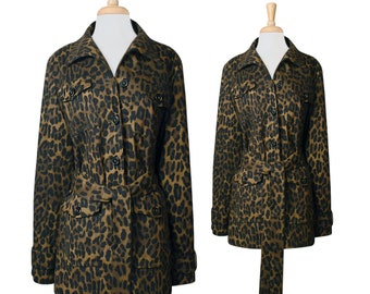 May include: A brown and black leopard print jacket with a belt and pockets. The jacket has a button-up front and long sleeves.