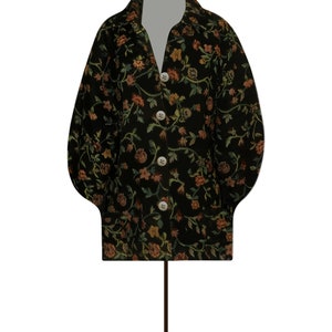 May include: A black floral patterned jacket with a button-up front and long sleeves. The jacket has a slightly puffed sleeve and a relaxed fit.