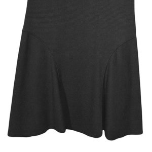 May include: A black ribbed skirt with a flared hem.