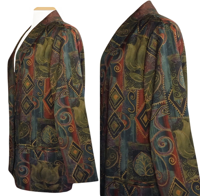 May include: A patterned blazer in shades of green, brown, and red, featuring geometric and floral designs. The blazer has a collarless design and two front pockets. The fabric has a textured appearance.