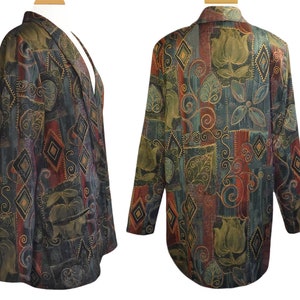 May include: A patterned blazer with a mix of colors including green, red, and gold. The blazer features a unique design with floral and geometric shapes. The jacket has a notched collar and two front pockets. The fabric appears to be a soft, textured material.