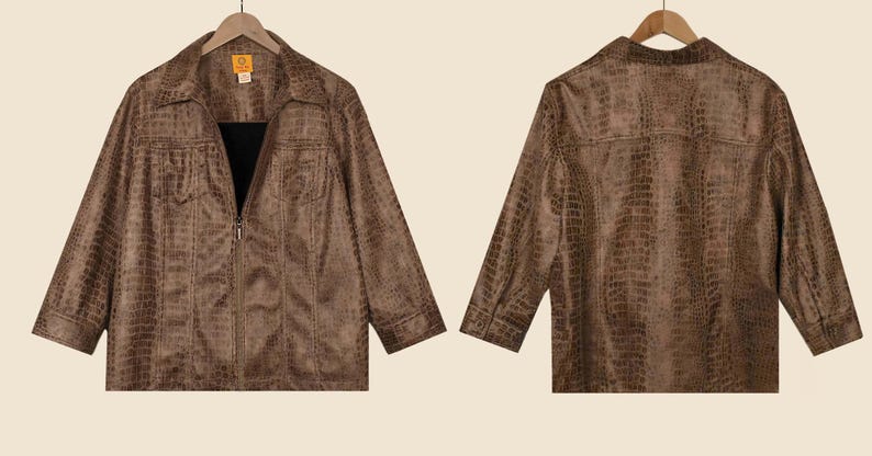 May include: Brown faux-leather jacket with a crocodile skin texture, front and back views. The jacket has a collared neckline, two chest pockets, and a zip-up closure. The sleeves are long, and the jacket hangs on a wooden hanger.