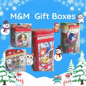 May include: Three metal M&M gift boxes featuring holiday themes. One is a red telephone booth, one is a train depot, and one is a control tower. The text M&M Gift Boxes is displayed at the top. The boxes are decorated with M&M characters.