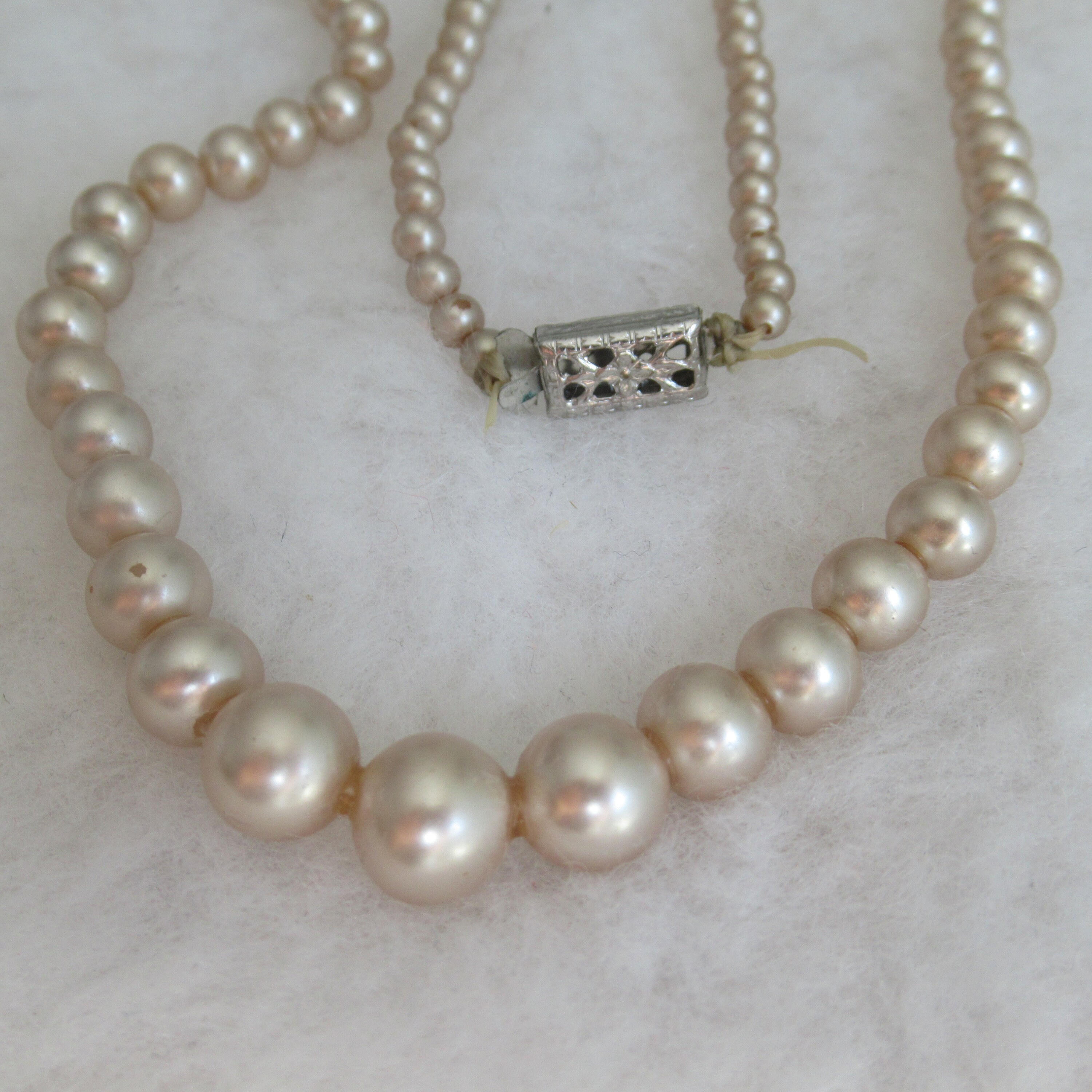 Vintage faux pearls: 125,700 ppm Lead. 90 ppm is unsafe. Please don't let  your children play with grandma's faux pearls!