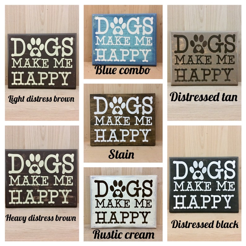 May include: A set of six wooden signs with the text "Dogs make me happy" in various distressed paint colors, including light brown, blue, tan, brown, cream, and black.