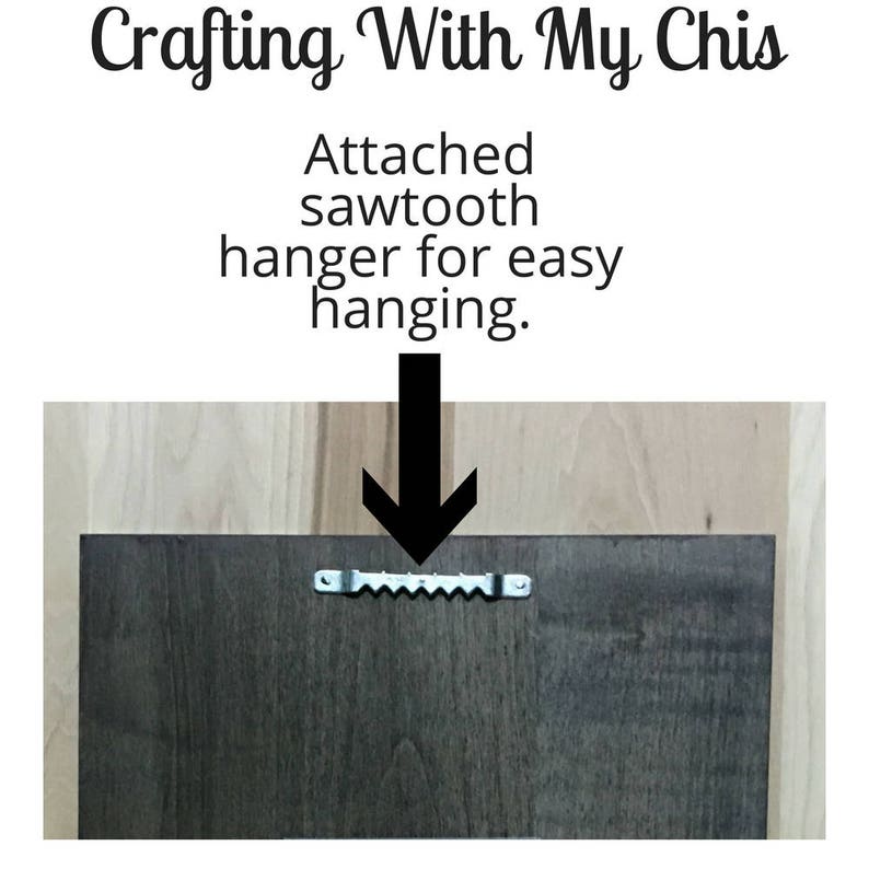May include: The back of a dark brown wooden sign with a sawtooth hanger attached for easy hanging. The text "Crafting With My Chis" is visible at the top of the image.