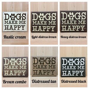 May include: Wooden signs with the phrase "DOGS MAKE ME HAPPY" in various colors: rustic cream, light distress brown, heavy distress brown, brown combo, distressed tan, and distressed black. Each sign features a paw print and heart design.