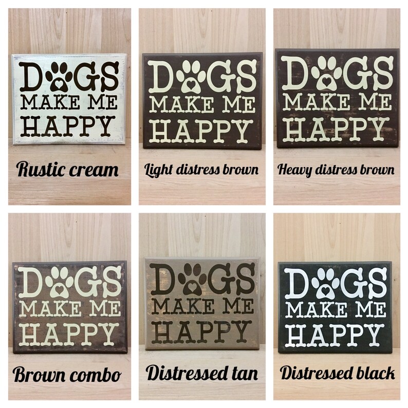 May include: Wooden signs with the phrase "DOGS MAKE ME HAPPY" in various colors: rustic cream, light distress brown, heavy distress brown, brown combo, distressed tan, and distressed black. Each sign features a paw print and heart design.