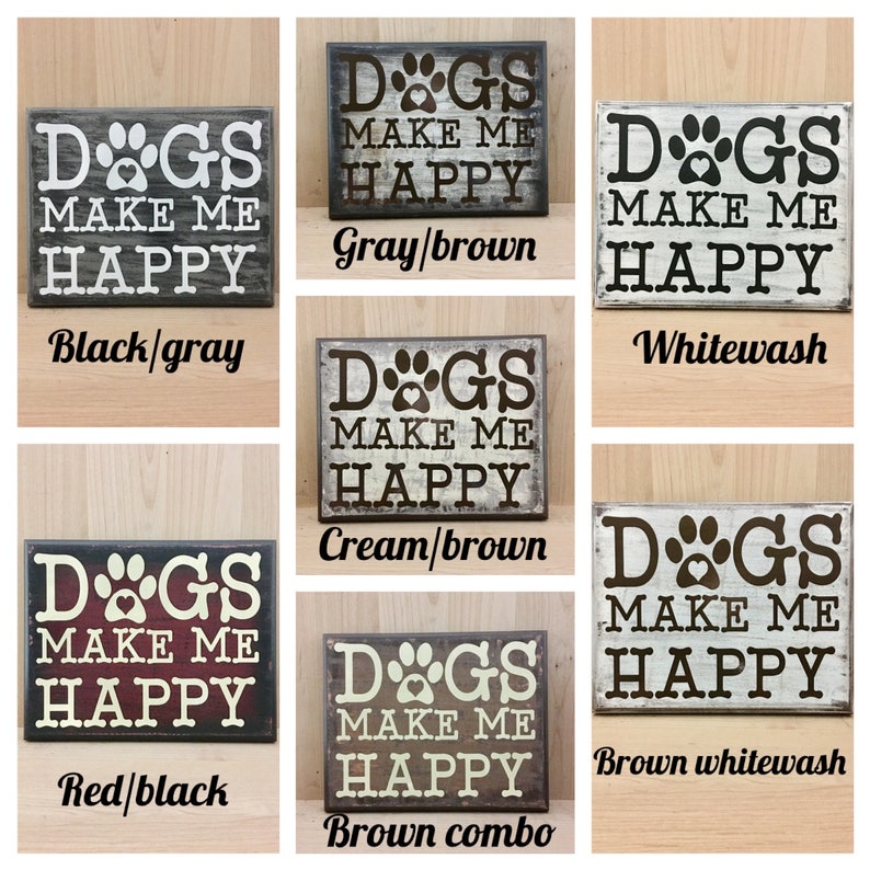 May include: A set of 10 wooden signs with the text "Dogs make me happy" in various color combinations. The signs are painted in black and gray, gray and brown, whitewash, cream and brown, red and black, and brown combo.
