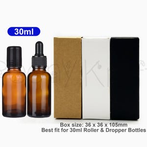 May include: Two amber glass 30ml bottles with black caps, one with a dropper, alongside three rectangular boxes in brown, white, and black. The boxes measure 36 x 36 x 105mm and are designed for 30ml roller and dropper bottles.