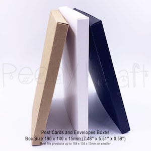May include: Three rectangular boxes in beige, white, and navy blue lean against each other. The beige box is on the left, followed by a white box, and a navy blue box on the right. Text on the image reads: Post Cards and Envelopes Boxes. Box Size: 7.48" x 5.51" x 0.59".