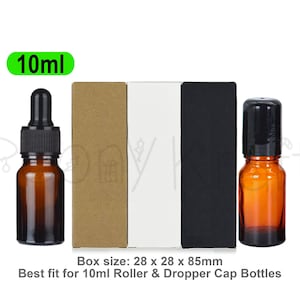 May include: Two amber glass bottles with black caps, one featuring a dropper and the other a roller ball, alongside three rectangular boxes in brown, white, and black. Text includes 10ml and Box size: 28 x 28 x 85mm Best fit for 10ml Roller & Dropper Cap Bottles.