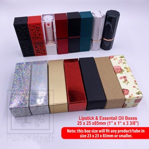 May include: A collection of lipstick and essential oil boxes in various colors and designs. The boxes are rectangular, with sizes of 1" x 1" x 3 3/8". The image includes boxes with glitter, metallic, and floral patterns. The text on the image says the box size will fit any product/tube in size 23 x 23 x 83mm or smaller.