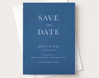May include: A rectangular blue save the date card with white serif text reading SAVE THE DATE, JENNA & PETE are getting married, 6TH JUNE 2027, PRESTWOLD HALL, LOUGHBOROUGH, and formal invitation to follow, resting on a white envelope.