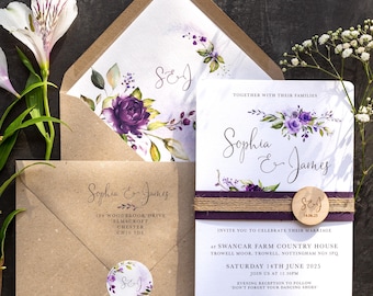 May include: Wedding invitation suite featuring floral designs in purple and green. The invitation card includes the names "Sophia & James", event details, and a wooden accent. Envelopes and a sticker with initials complete the set.