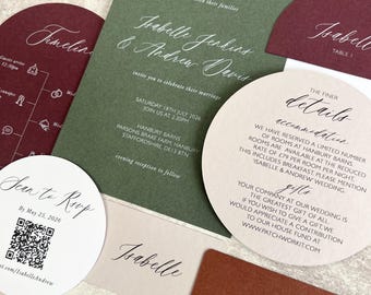 May include: A wedding stationery set featuring a rectangular olive green invitation, a circular beige details card, a burgundy arched timeline card, a white circular RSVP card with a QR code, and small rectangular name cards in beige and terracotta.