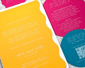 May include: A wedding invitation suite featuring a rectangular yellow card with wavy edges, a circular pink card titled The Small Print, a circular teal RSVP card with a QR code, and a small pink name tag labeled Amelie, all with white text.