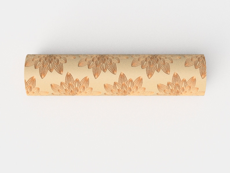 May include: A beige cylinder with a repeating pattern of brown floral designs.