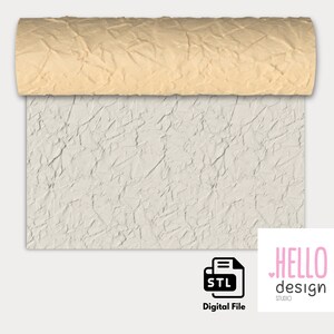 May include: A digital file for a 3D printed textured wall panel. The panel has a light gray, crumpled paper-like texture. The file is in STL format.  HELLO design STUDIO is printed in pink on a white background.