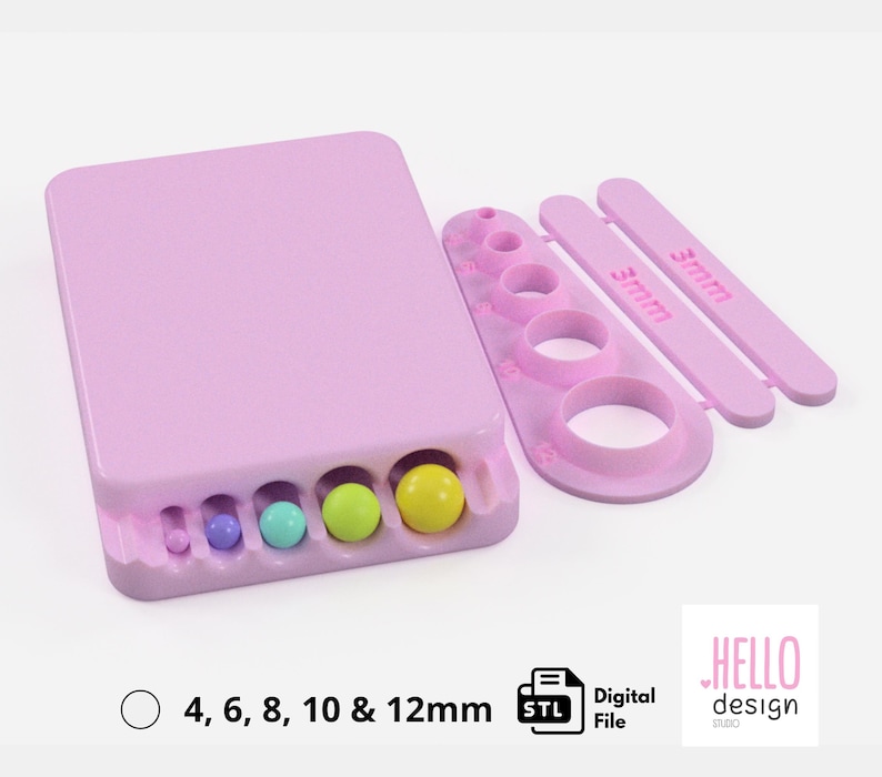 Puede incluir: Un molde de impresi&oacute;n 3D rosa para hacer caramelos redondos. El molde tiene cinco cavidades de diferentes tama&ntilde;os para hacer caramelos con di&aacute;metros de 4, 6, 8, 10 y 12 mm. El molde se muestra con un conjunto de cinco caramelos redondos en las cavidades.