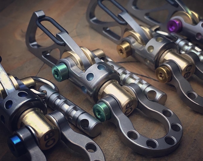 Featured listing image: High quality keychain made of titanium in the style of high competition engines