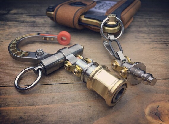 This Quick-Release Titanium Keychain Hides a Box Cutter Inside