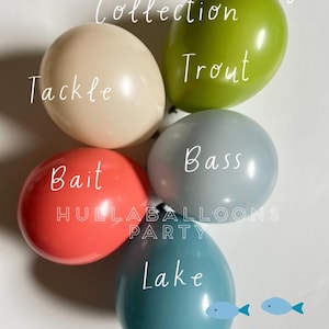May include: Five balloons with fishing-themed words: "Tackle", "Trout", "Bass", "Bait", and "Lake". The balloons are in the colors beige, green, light blue, coral, and teal.