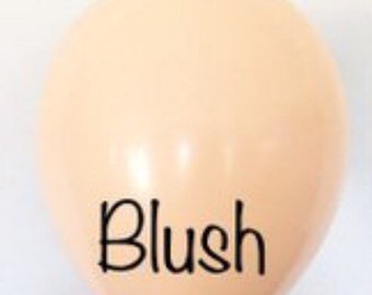 May include: A peach-colored balloon with the word "Blush" printed in black.