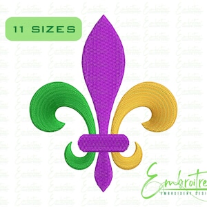 May include: Embroidered fleur-de-lis design in purple, green, and gold. The design features the text "11 SIZES" in a green rectangle. The logo for Embroitree Embroidery Designs is in the bottom right corner.