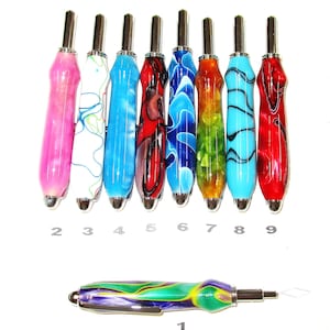 May include: A collection of nine colorful craft tools with metallic tips and patterned handles. The handles feature a variety of colors including pink, white, blue, red, green, and a multi-colored design. The tools are numbered 1 through 9.