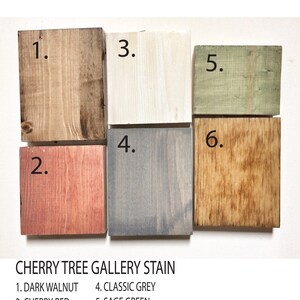 May include: Six wood stain samples labeled with numbers 1 through 6. The stain colors are dark walnut, cherry red, white washed, classic grey, sage green, and rustic warm brown.