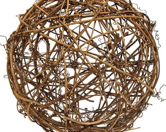 May include: A brown, spherical wreath made of woven twigs and branches.