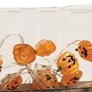 May include: A string of orange pumpkin-shaped lights with black painted facial features, connected by thin silver wires. The decorative light strand is contained within a clear, rectangular plastic display box for storage and visibility.