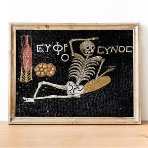 May include: A black and white mosaic depicting a skeleton with the text "EYΦΦ EYNOE".