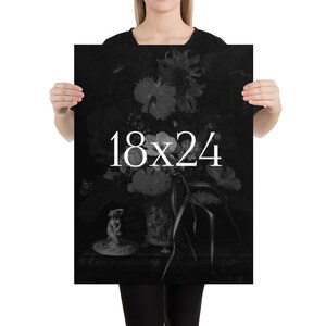 May include: Black and white print of a still life featuring a vase of flowers, a small statue, and the text "18x24".