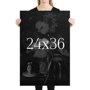 May include: Black and white poster print of a still life featuring a vase of flowers with a small statue in the foreground. The text "24x36" is printed in white on the poster.