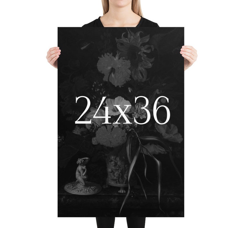 May include: Black and white poster print of a still life featuring a vase of flowers with a small statue in the foreground. The text "24x36" is printed in white on the poster.
