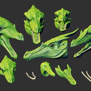 Könnte beinhalten: Ein Set aus grünen Drachenkopf-Skulpturen mit filigranen Details und geöffneten Mäulern, bereit zum Zusammenbauen. Das Set enthält verschiedene Teile, darunter Kopf, Kiefer und Zähne.